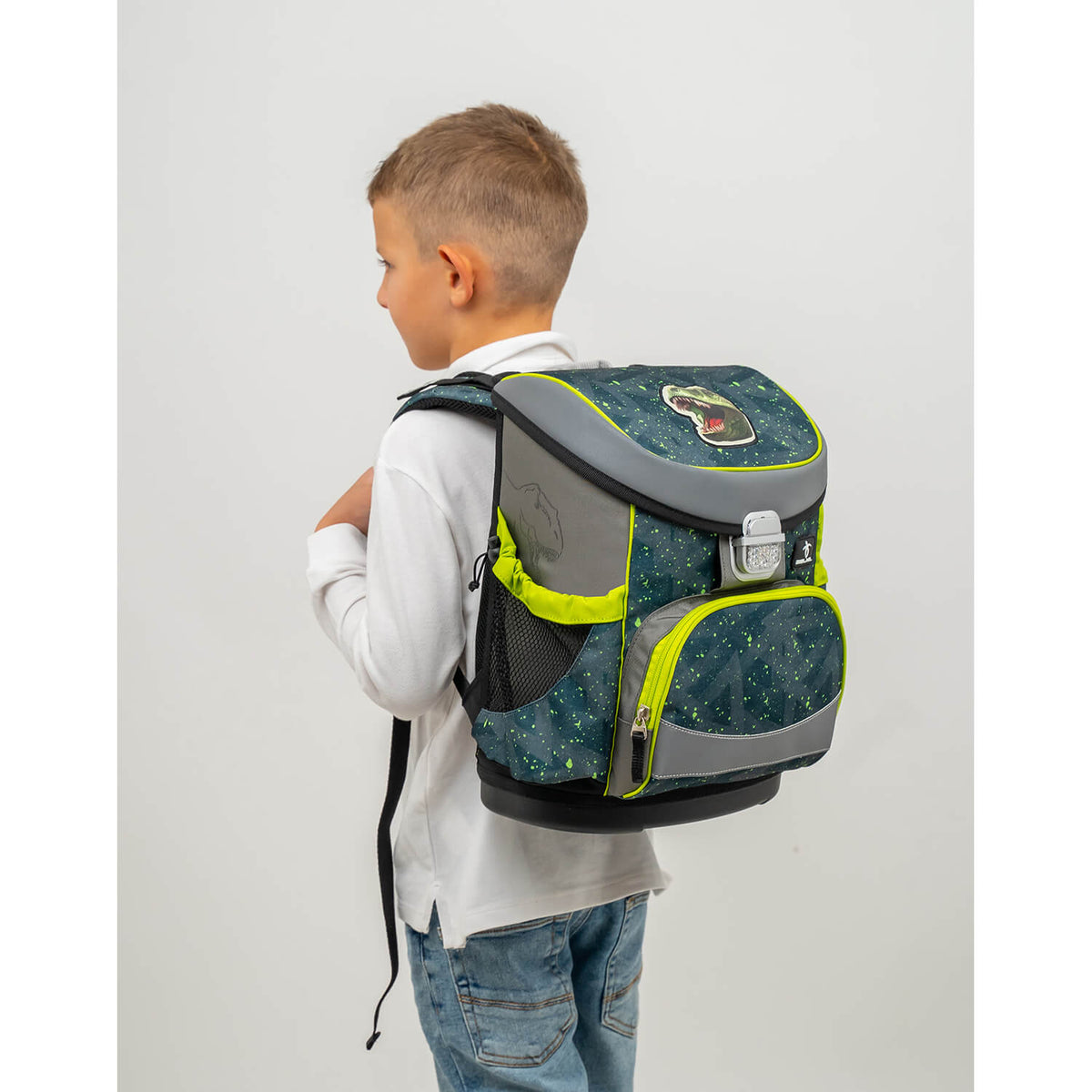 Side view of a boy with the Belmil Mini-Fit T-rex Roar schoolbag, highlighting its comfortable fit and adjustable straps - Ergonomic School Bag Set for Boys – Belmil Mini-Fit T-rex Roar (4 pcs).