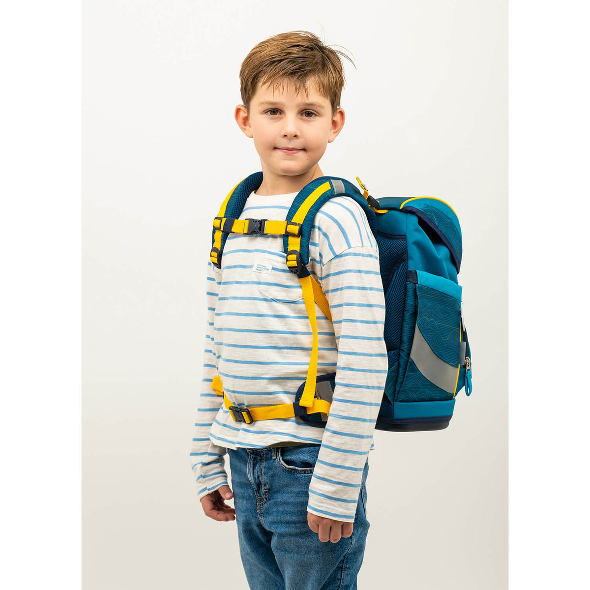 The vibrant design of the Belmil Smarty Waves Orange Ergonomic School Bag Set – 5-Piece Set with 9 Interchangeable Patches and Hip Belt highlights wild animal patches.