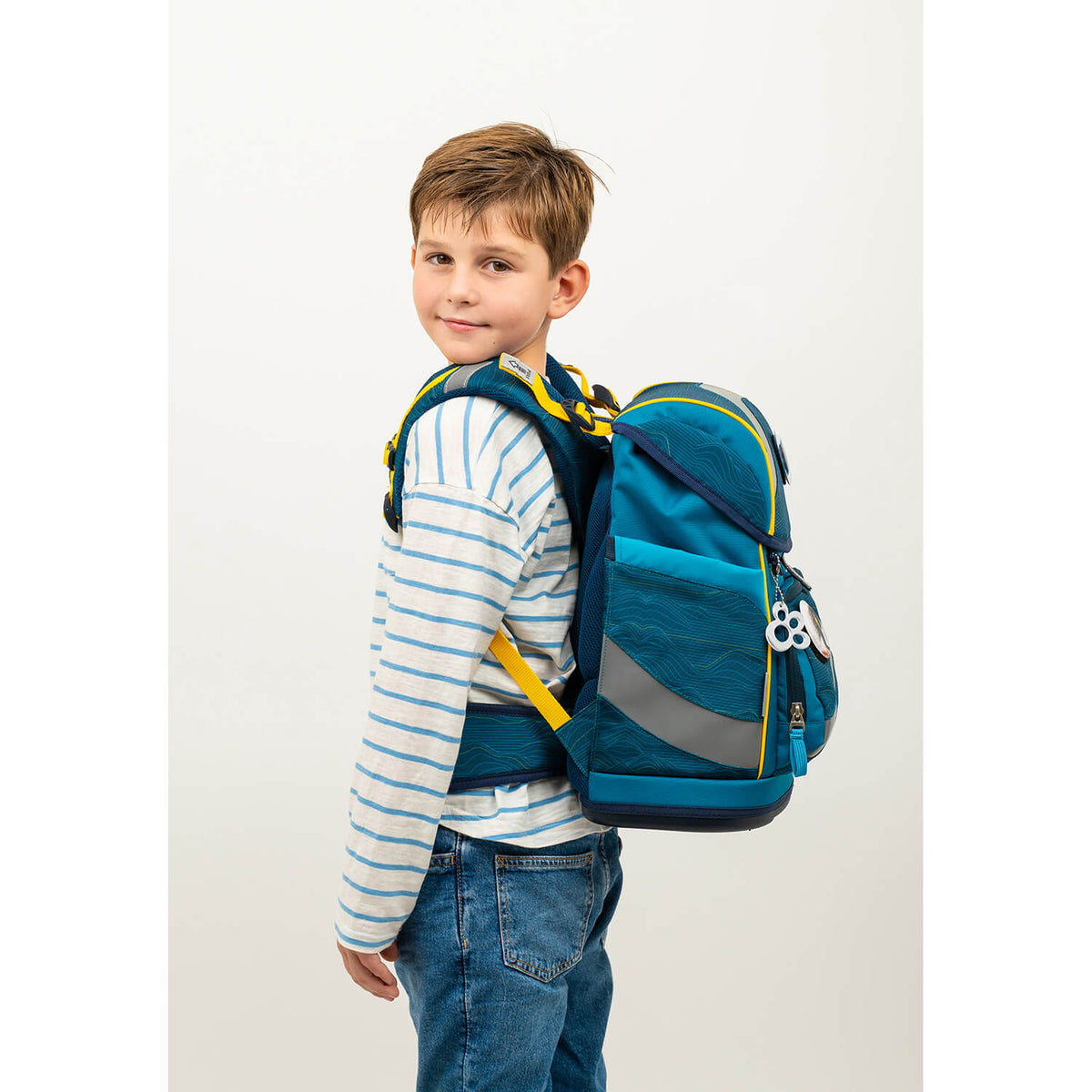 The ergonomic back of the Belmil Smarty Waves Orange Ergonomic School Bag Set – 5-Piece Set with 9 Interchangeable Patches and Hip Belt promotes healthy posture.