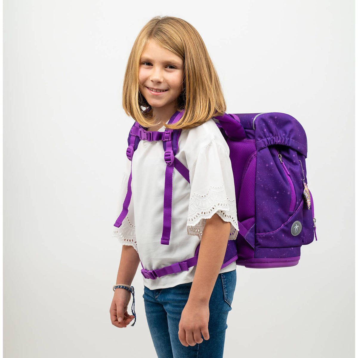 Close-up of the Belmil Motion Purple Sky Backpack featuring 9 interchangeable patches for personalized style.