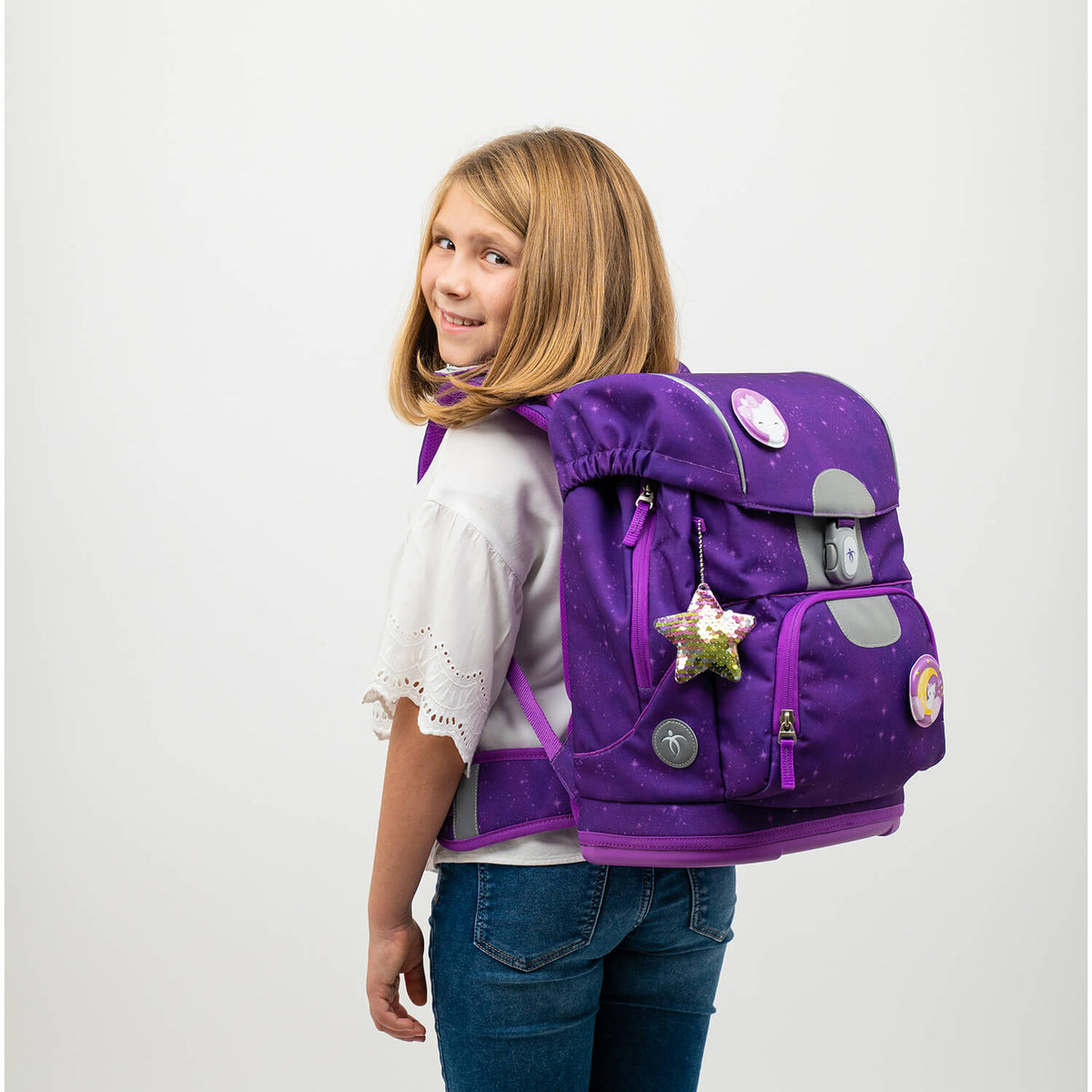 Lightweight ergonomic school backpack made from recycled materials, ideal for kids, weighing around 900-960g.