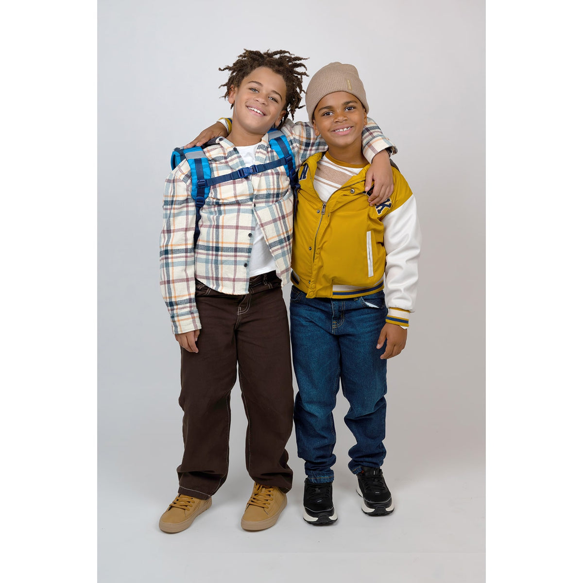 Kids using the Belmil Classy Plus Animal Kingdom School Bag Set for Boys + Stone Age Patch Set (5 pcs) with adjustable straps and padded back.