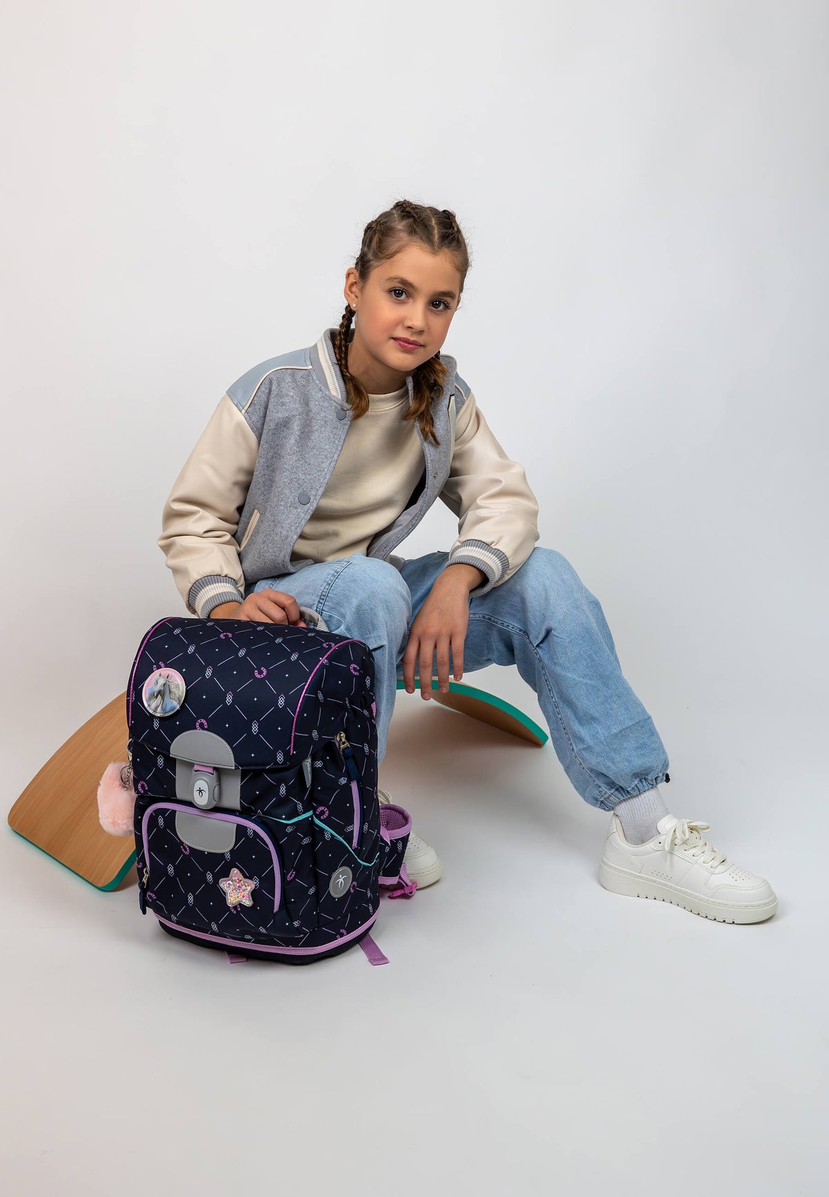 The Belmil Motion Midnight Gallop Ergonomic School Bag Set – Made from Recycled Materials, 5 pcs, with 9 Interchangeable Patches featuring interchangeable horse-themed patches.